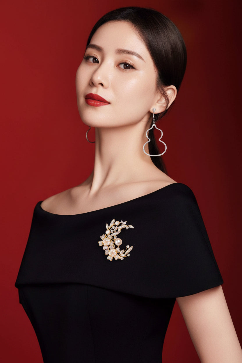A lady wearing an elegant laurel goddess brooch, adorned with natural pearls and shell flowers.