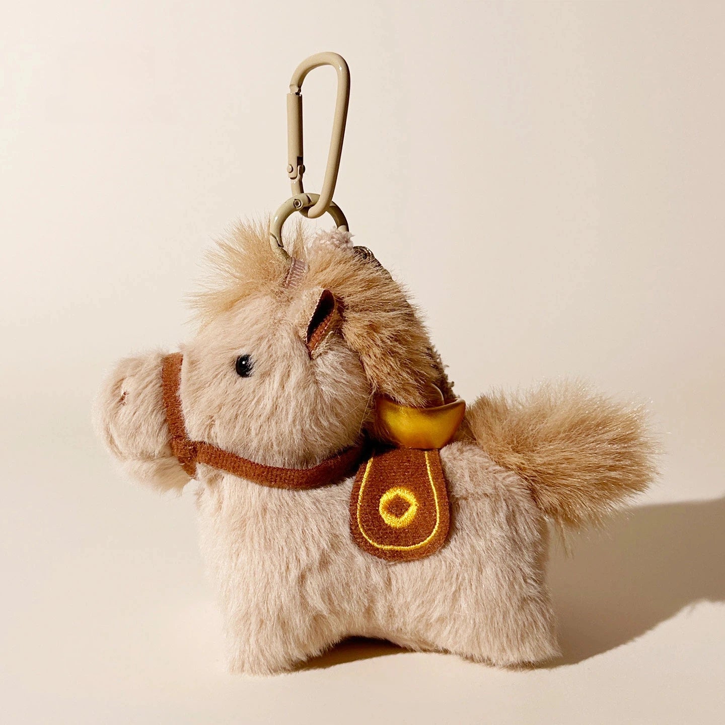 Lucky Pony Plush Bag Charm - product image 1 showing the pony bag charm