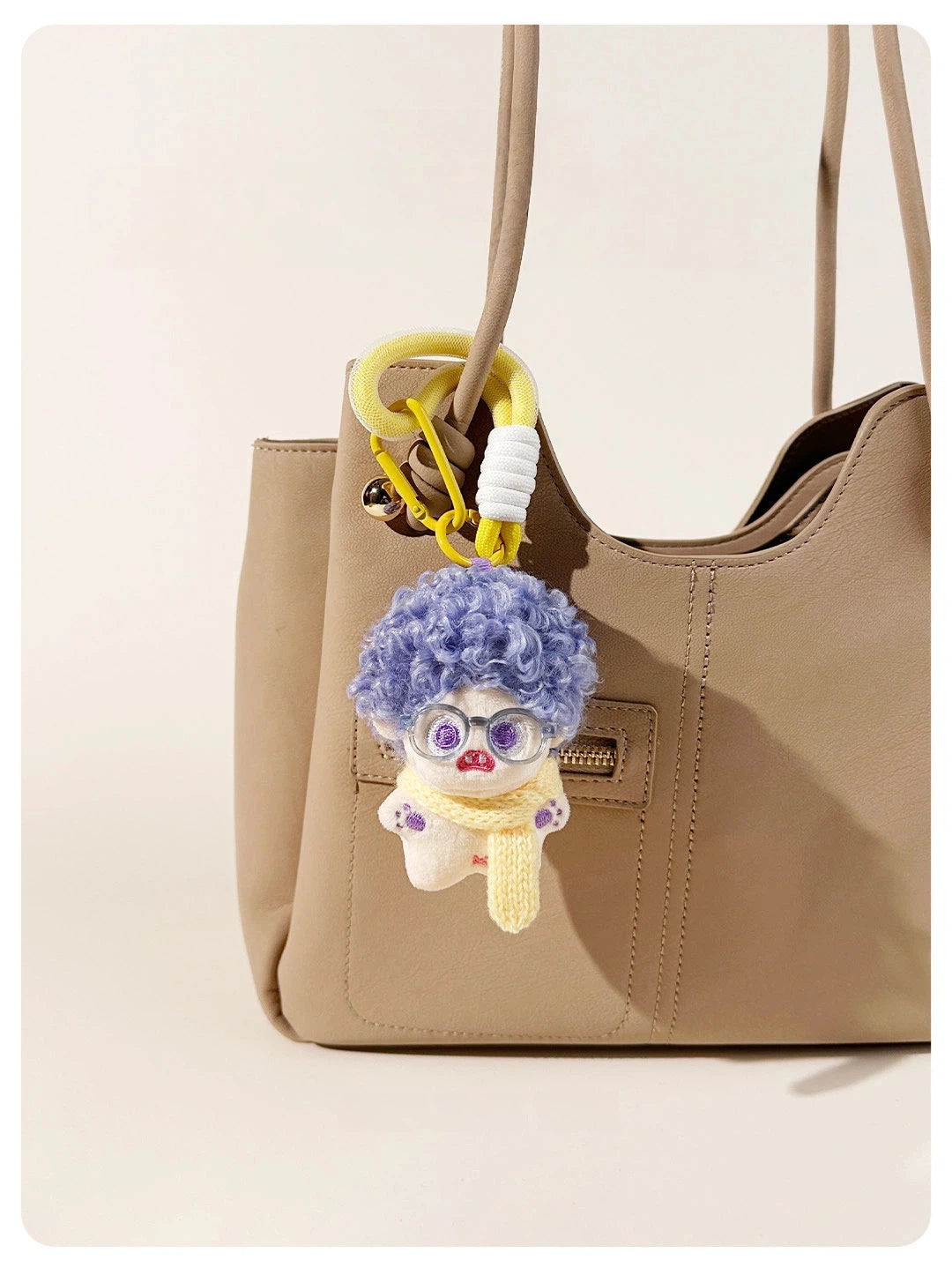 Fuzzy Doll Plush Bag Charm - product image 6 showing the fuzzy doll bag charm