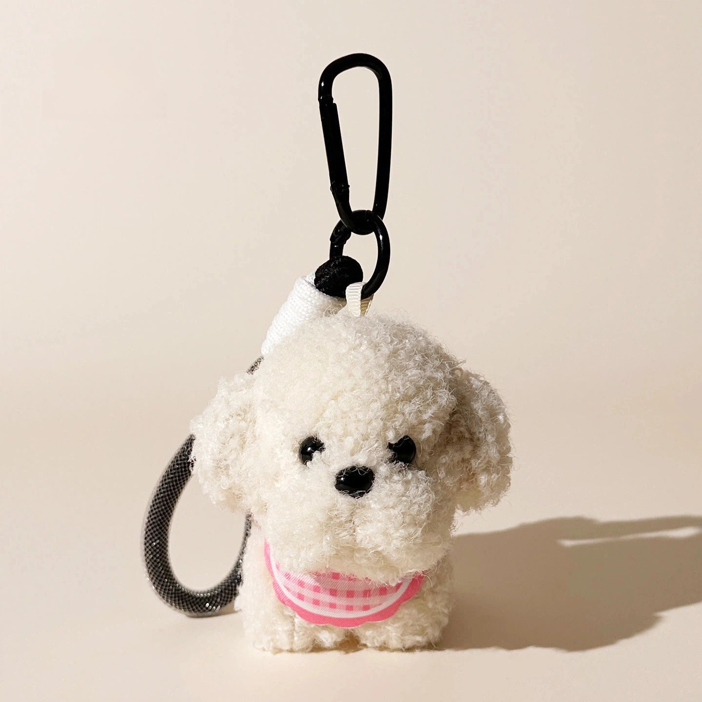 Round Puppy Plush Bag Charm - product image 1 showing the round puppy bag charm