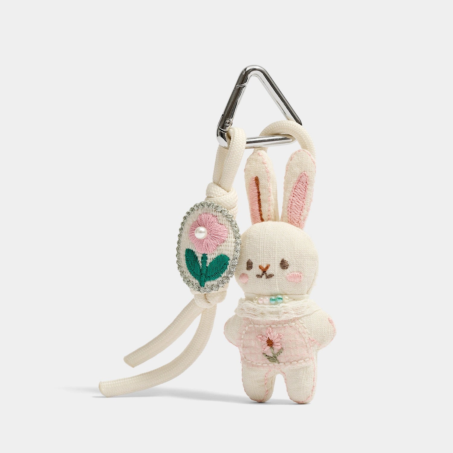 Pink and Blue Knitted Bunny Bag Charms angled product view showing knit bunny color pair