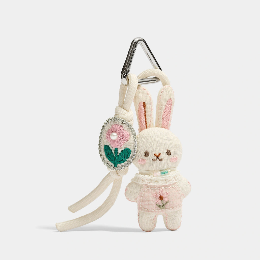 Pink and Blue Knitted Bunny Bag Charms close detail view showing knit bunny color pair