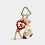 Scarf Duck Bag Charm group styling view showing scarf-wrapped duck