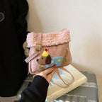 Party Hat Puppy Crossbody Bag with Curly-Textured Trim in Pink.