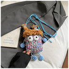 Wide-Eyed Knit Creature Crossbody Phone Pouch in Blue.