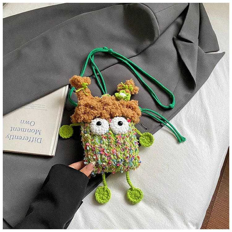 Wide-Eyed Knit Creature Crossbody Phone Pouch in Green.