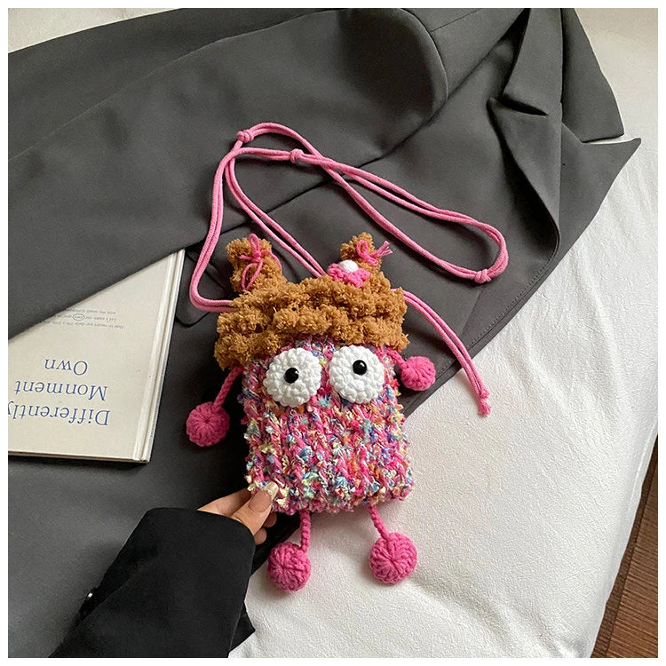 Wide-Eyed Knit Creature Crossbody Phone Pouch in Pink.
