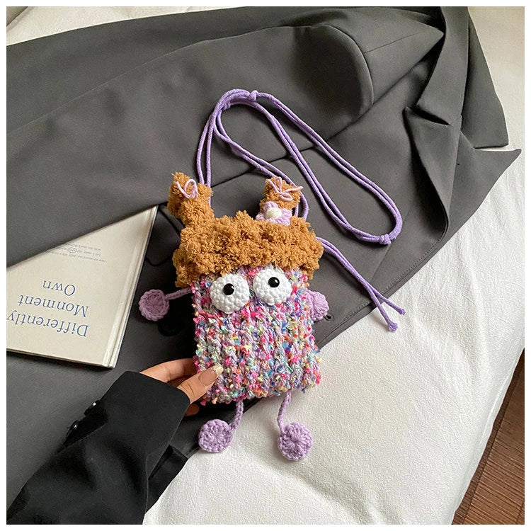 Wide-Eyed Knit Creature Crossbody Phone Pouch in Purple.