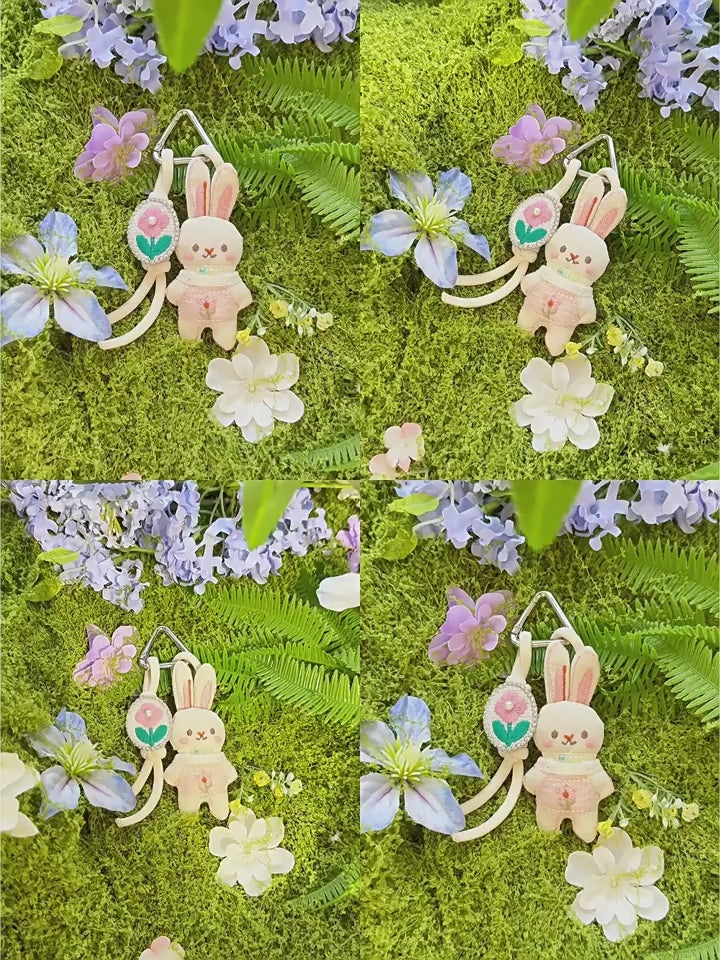 Pink and Blue Knitted Bunny Bag Charms product video showing the charm in motion
